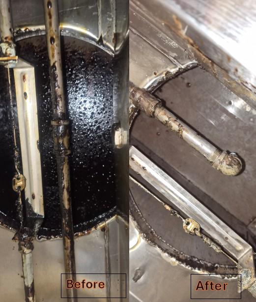 Inside view of commercial kitchen canopy hood after professional cleaning — grease removed to bare metal