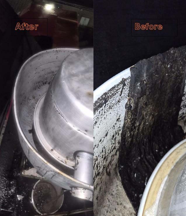 Interior of commercial kitchen exhaust fan after cleaning — blades and housing degreased