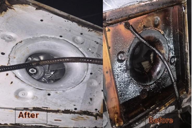 Rooftop commercial kitchen exhaust fan after professional cleaning and inspection